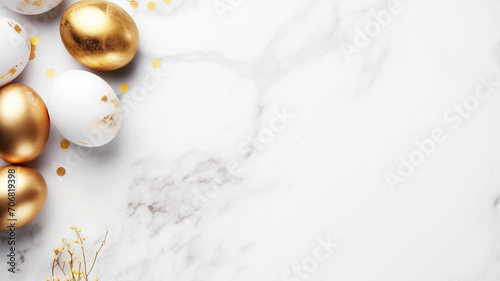 Flatlay composition Golden Easter eggs with flowers on a white marble background.  photo