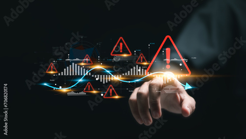 Foto Businessman touching virtual world economic growth chart with red warning sign for caution in investing economic situation warning, Business investment risks