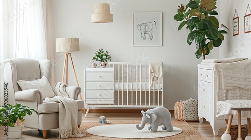 Baby room with chest of drawer, unisex white cot, big toy elephant, home plant, armchair and floor lamp. Nursery in Japandi or Scandinavian Style. Interior Background