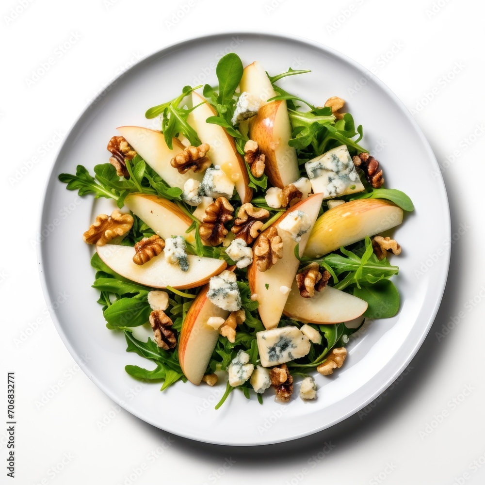Blue Cheese Pear Walnut Salad on a round white plate, on a plain white background Blue Cheese Pear Walnut Salad on a round white plate, on a plain white background