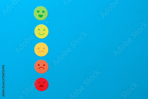 Customer service evaluation and satisfaction survey concepts. Happy and sad face icon on blue background.