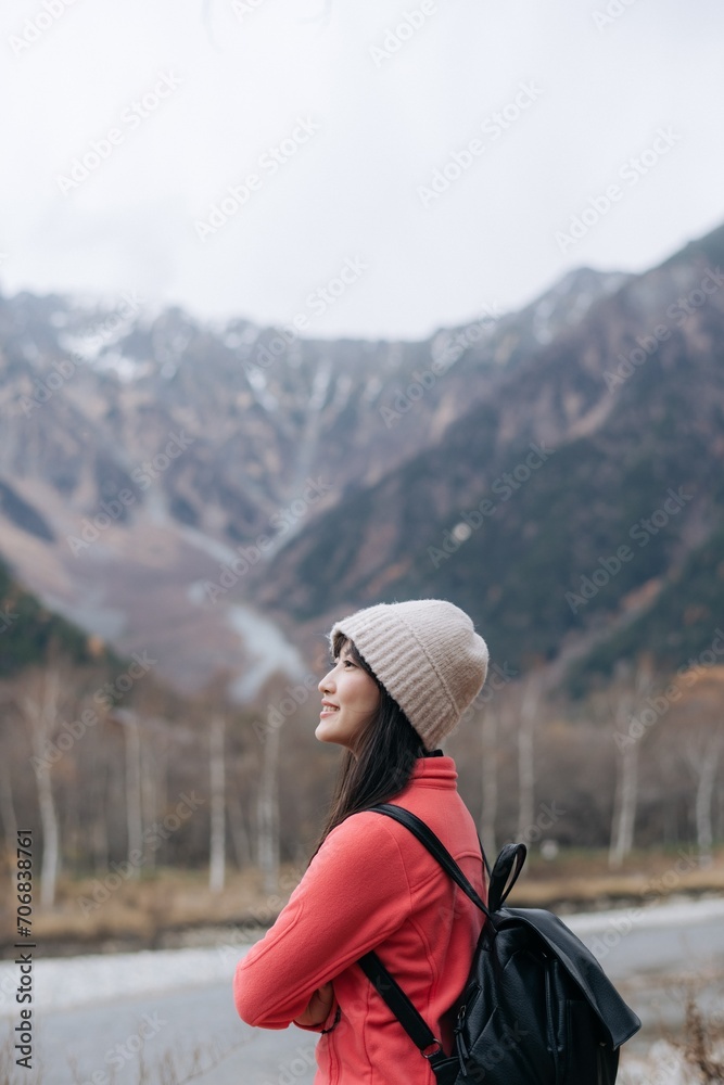Alone in nature's embrace, Asian woman in a pink fleece. Climbing, standing by the lake, and exploring the scenic beauty of Japan's breathtaking destination. Alone in nature's embrace, Asian woman in a pink fleece. Climbing, standing by the lake, and exploring the scenic beauty of Japan's breathtaking destination.