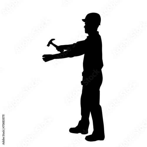 Silhouette of a worker carrying hammer tool. Silhouette of a worker in action pose using hammer tool.