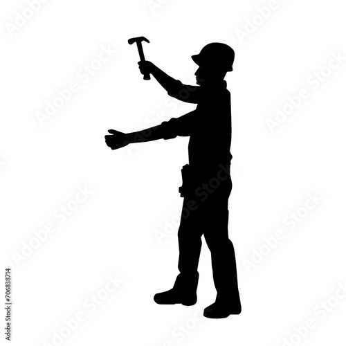 Silhouette of a worker carrying hammer tool. Silhouette of a worker in action pose using hammer tool.