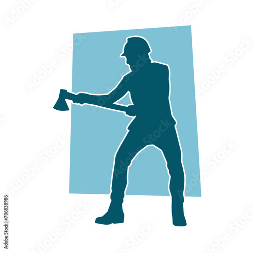 Silhouette of a worker in action pose using his axe tool.