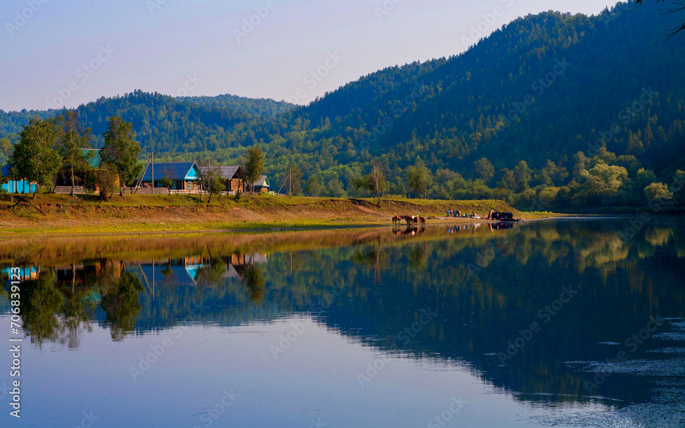 the beautiful village of Kutanovo Burzyansky district in the Republic of Bashkortostan on the banks of the Belaya River surrounded by the Ural Mountains on a summer day