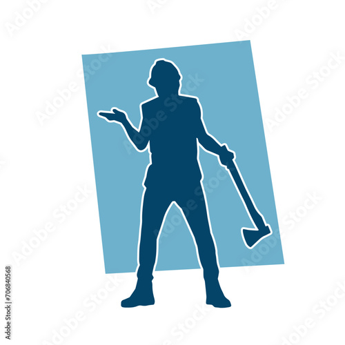 Silhouette of a worker in action pose using his axe tool.