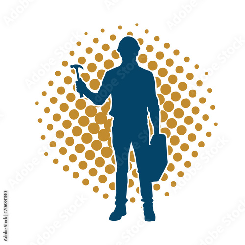 Silhouette of a worker carrying hammer tool. Silhouette of a worker in action pose using hammer tool.