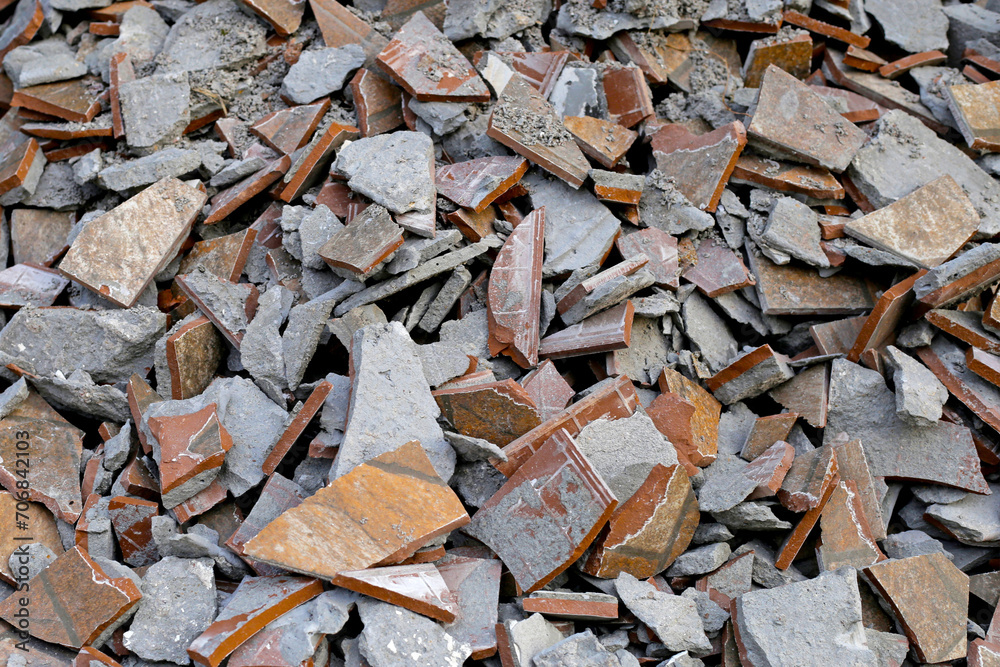 Piles of broken floor tiles from house renovations