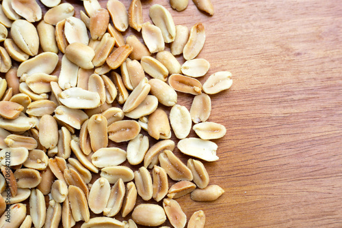 Peanut on wooden plate. Copy space