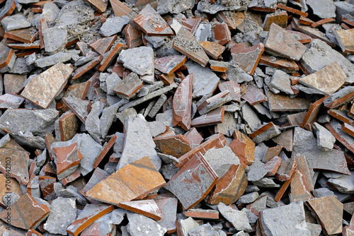 Piles of broken floor tiles from house renovations
