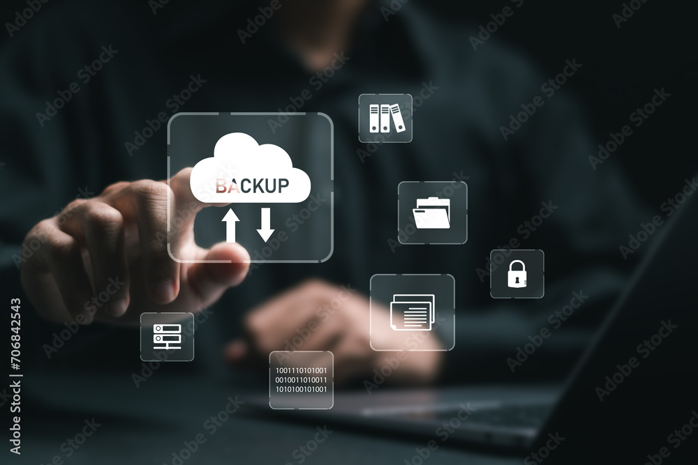 Backup storage data technology concept. businessman use laptop with virtual backup icons for backup online documentation database and digital file storage system or software,file access, doc sharing. Backup storage data technology concept. businessman use laptop with virtual backup icons for backup online documentation database and digital file storage system or software,file access, doc sharing.