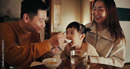 Food, home and Japanese parents and child at table for lunch, breakfast and eating meal together. Happy family, culture and mother, father and young girl in house for bonding, relationship and love