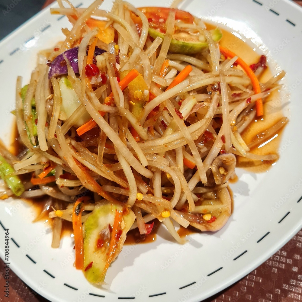 Papaya salad with crab and fermented fish, Close up image. Papaya salad with crab and fermented fish, Close up image.