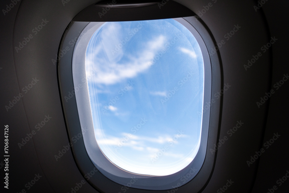 View of the clouds through the porthole.. window of airplane