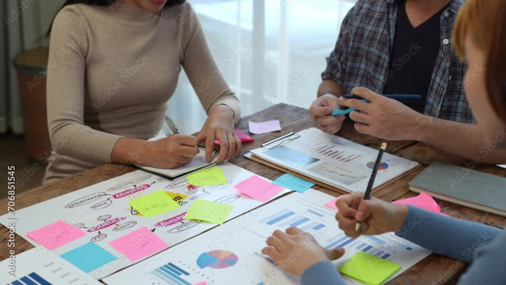 Young Asian Creative Business Conference Group Work as a team to discuss project initiation strategies, analyze financial processes. Plan and brainstorm online marketing ideas with your office laptop.