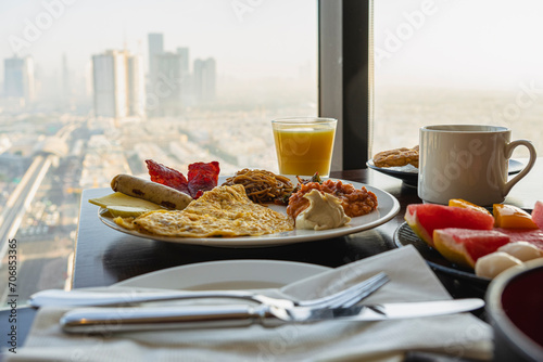 Obraz na plátně breakfast at hotel with Arabic food on the background of a beautiful view of the sights of Dubai