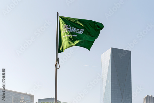 flag of Saudi Arabia against the background of tall building,