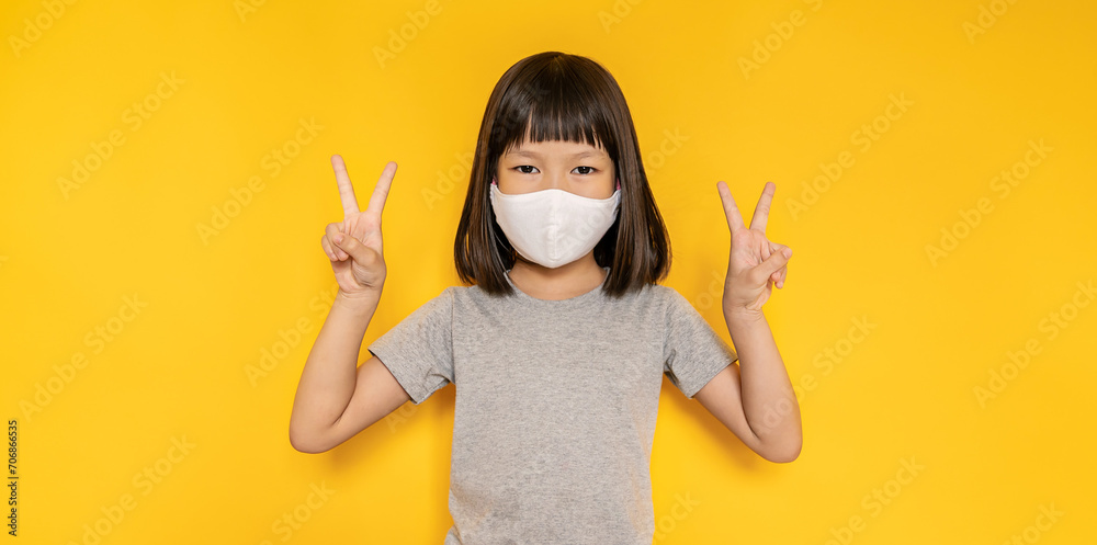 Portrait of asian little girl wearing mask protect from corona virus pm 2.5. Asia toddler girl wearing surgical face mask against flu disease, epidemic virus social distancing, back to school concept - obrazy, fototapety, plakaty 