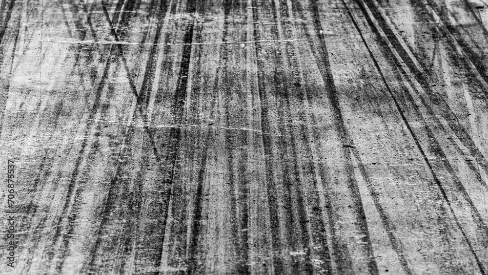 Fototapeta premium Tire track mark on asphalt tarmac road race track texture and background, Abstract background black tire tracks skid on asphalt road in racing circuit, Tire mark skid mark on asphalt road.