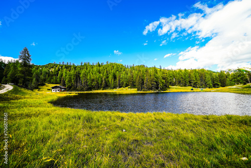 Krallersee on the high plateau of the Tauplitzalm. View of the lake at the Totes Gebirge in Styria. Idyllic landscape with green nature and a lake on the Tauplitz.