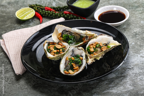 Open half oysters with green onion