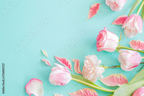 beautiful pink spring flowers on blue background
