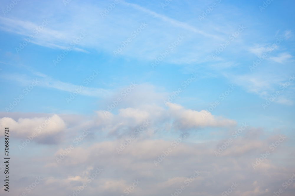 A beautiful sky tinted by the sun leaving vibrant shades of gold, pink, blue and multicolored. Clouds in the twilight evening and morning sky. Cloudy sky background in the evening and during the day.