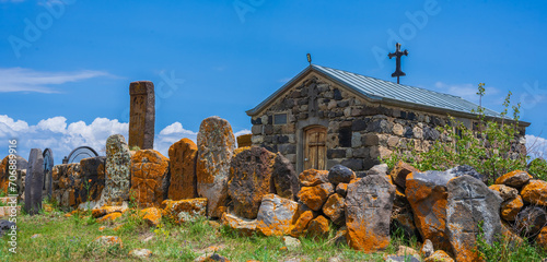 Artsvatrich Chapel on the shore of Lake Sevan, ancient khachkars with the image of a cross are Armenian shrines photo