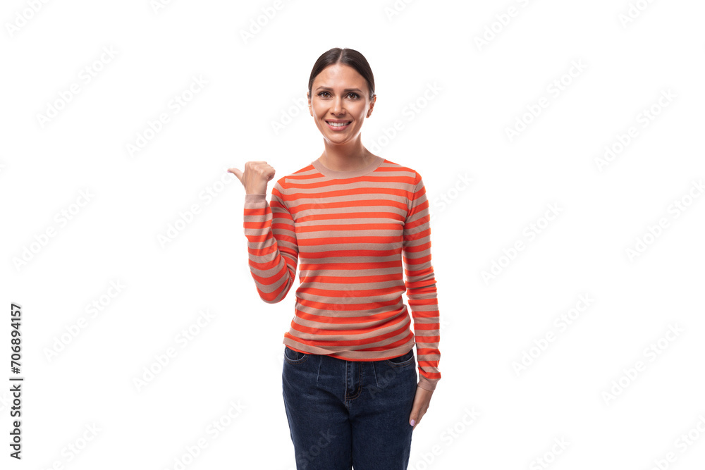 caucasian cheerful young black-haired woman with a ponytail dressed in an orange jacket actively gesticulates caucasian cheerful young black-haired woman with a ponytail dressed in an orange jacket actively gesticulates