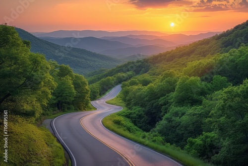 Winding Road Through a Sunset Kissed Forested Mountain