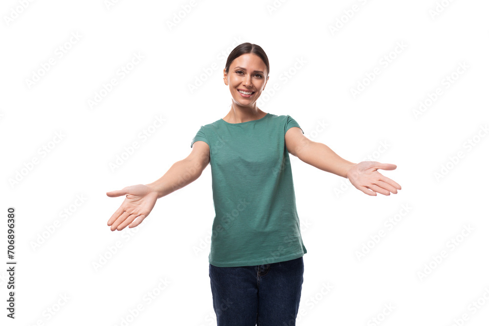 young happy brunette woman in t-shirt rejoices on white background with copy space young happy brunette woman in t-shirt rejoices on white background with copy space