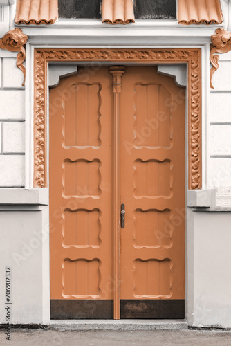 closeup of color door. New trending PANTONE Peach Fuzz colour of 2024 year (ID: 706902337)