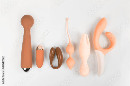 Silicone sex toys on a white background. Erotic toy for fun. Sex gadget and masturbation device. (ID: 706902722)