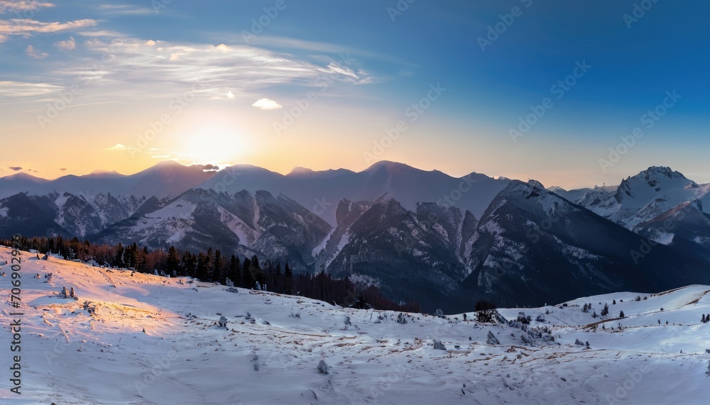 Winter panoramic view of the snowy high mountains Winter panoramic view of the snowy high mountains