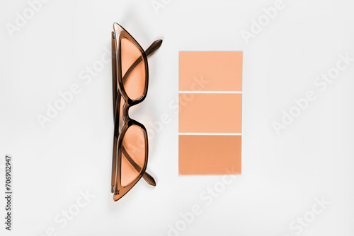 Color samples palette design catalog. New trending PANTONE Peach Fuzz colour of 2024 year (ID: 706902947)