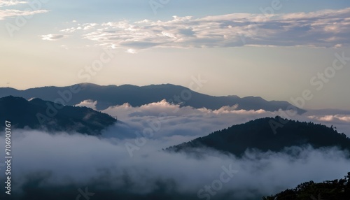 Photograph of white fog with mountains on the side