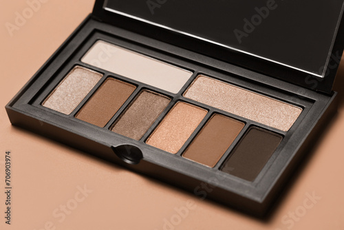 Various makeup products on dark background with copyspace (ID: 706903974)