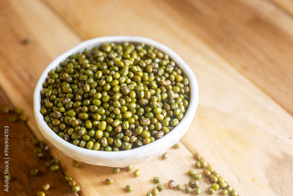 mung beans I white ceramic bowl on wooden table background. mung beans I white ceramic bowl on wooden table background.