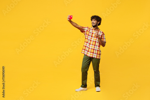 Canvas Print Full body young Indian man wear shirt casual clothes doing selfie shot on mobile