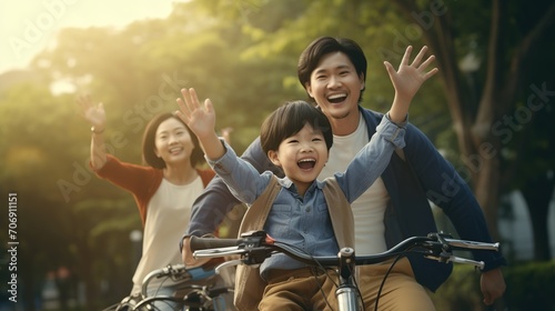 Happy Asian father and mother teach their son to ride a bicycle. Image of happy family. high quality photo.