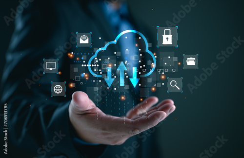 Businessman showing virtual glowing cloud computing to download and loading data information and upload on system network application. Technology data transformation concept, data transfer. photo