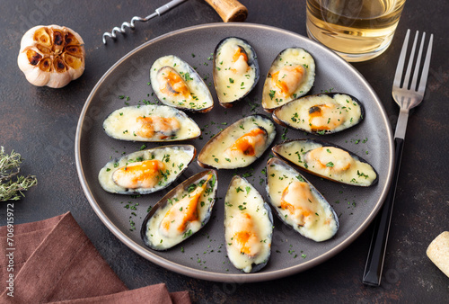 Baked mussels with cheese and herbs. Seafood. Healthy eating.