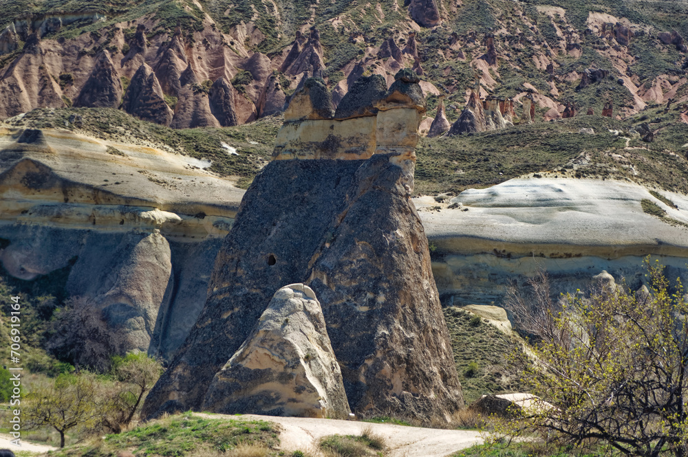 Cappadocia landscape soft volcanic rock, shaped by erosion into towers.