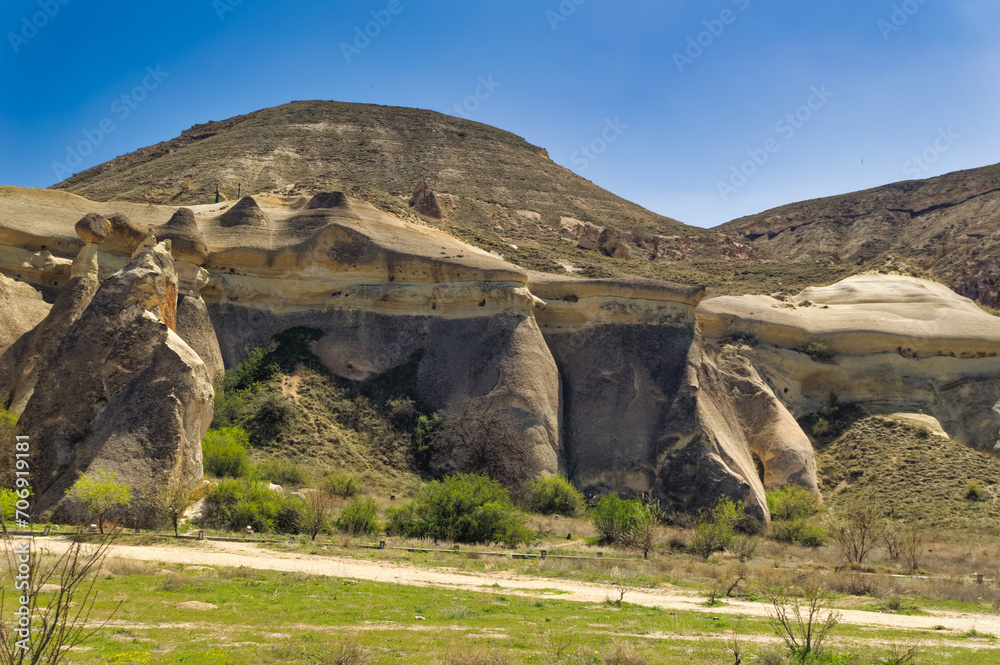 Cappadocia landscape soft volcanic rock, shaped by erosion into towers.