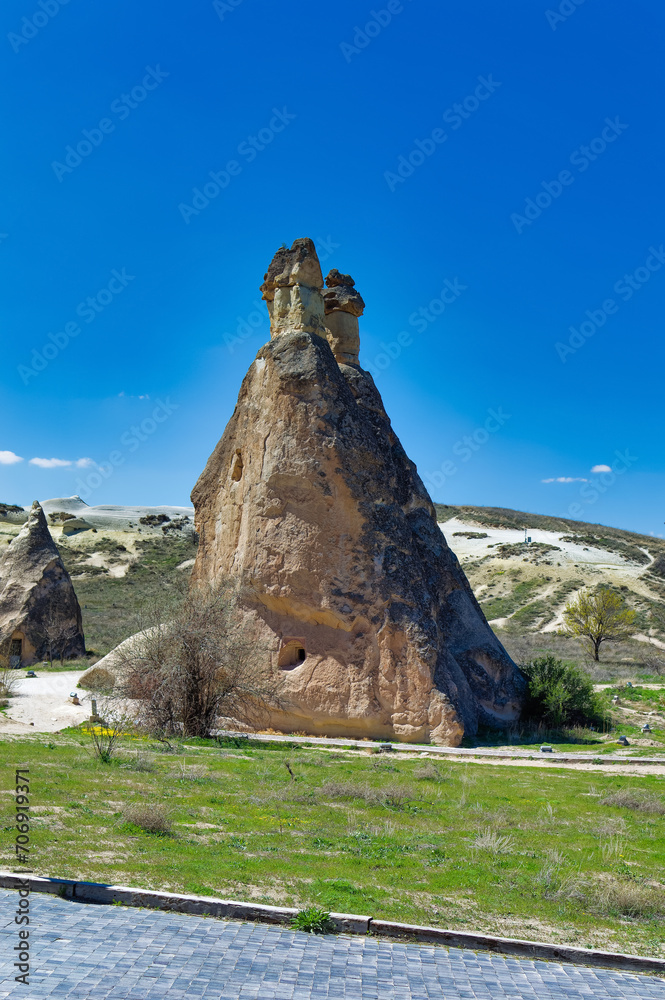Cappadocia landscape soft volcanic rock, shaped by erosion into towers.