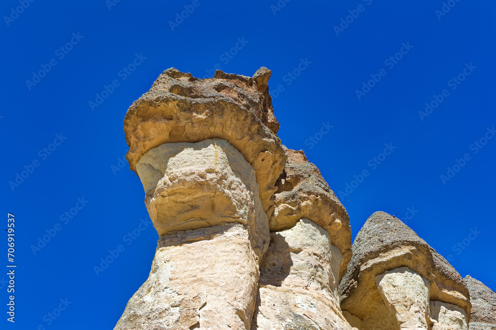 Cappadocia landscape soft volcanic rock, shaped by erosion into towers.