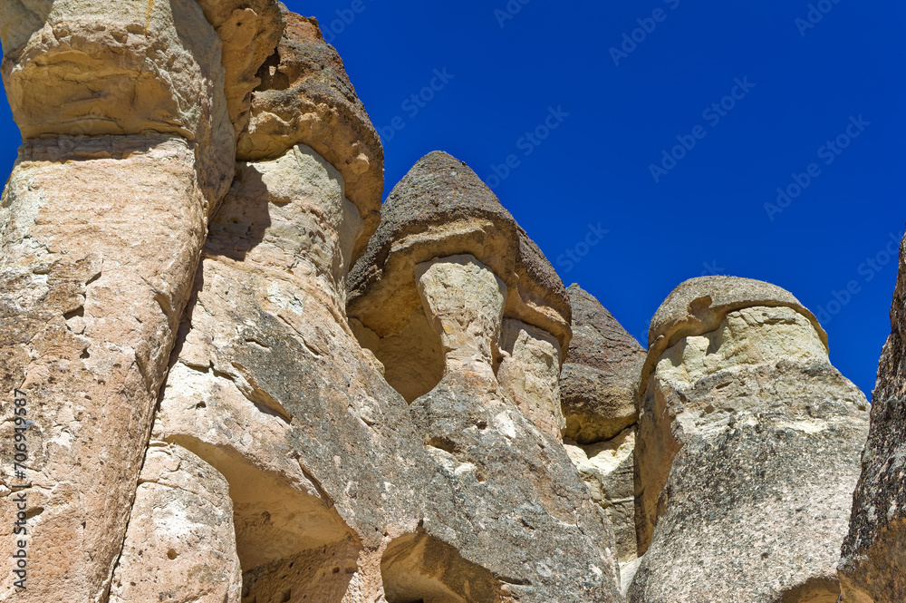 Cappadocia landscape soft volcanic rock, shaped by erosion into towers.