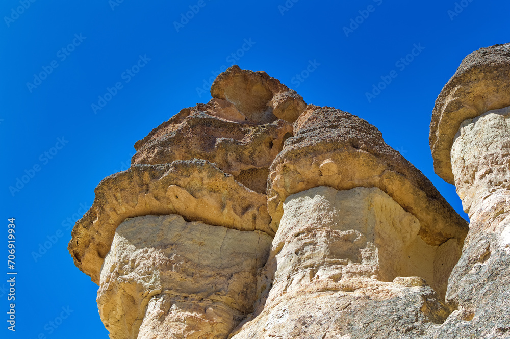 Cappadocia landscape soft volcanic rock, shaped by erosion into towers.