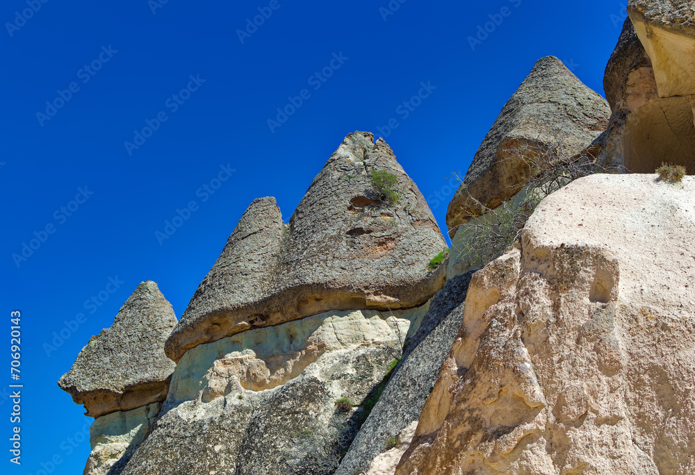 Cappadocia landscape soft volcanic rock, shaped by erosion into towers.